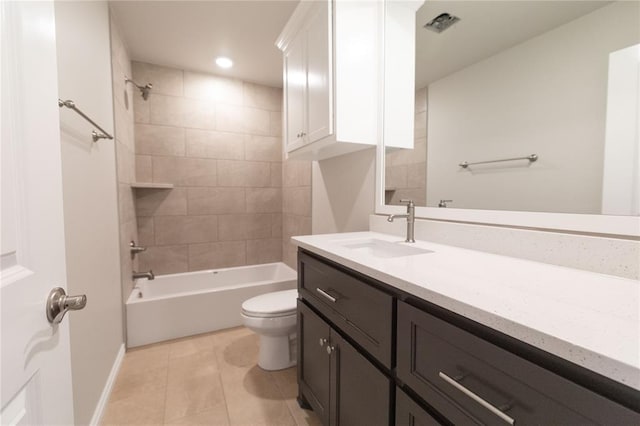 bathroom featuring baseboards, bathing tub / shower combination, toilet, tile patterned floors, and vanity