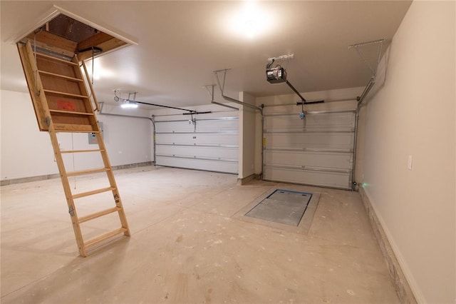 garage with baseboards and a garage door opener