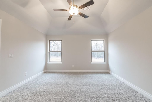 unfurnished room with lofted ceiling, carpet floors, a wealth of natural light, and baseboards