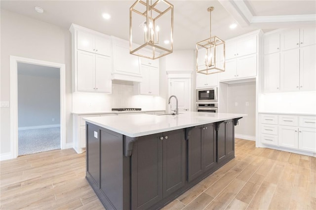 14109 Birch Ln, Edmond, OK 73049 - kitchen with a chandelier, white cabinetry, built in microwave, oven, and stovetop