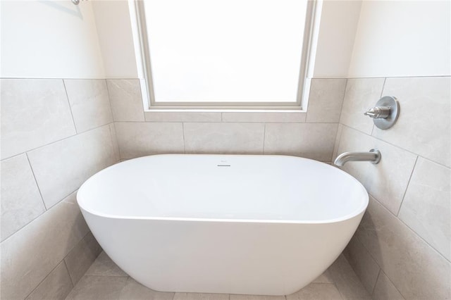 14109 Birch Ln, Edmond, OK 73049 - full bathroom featuring a freestanding tub and tile walls