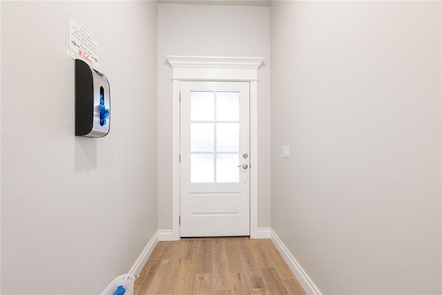 14109 Birch Ln, Edmond, OK 73049 - doorway to outside featuring light wood finished floors and baseboards