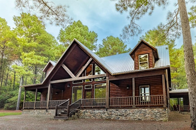 log cabin featuring a porch