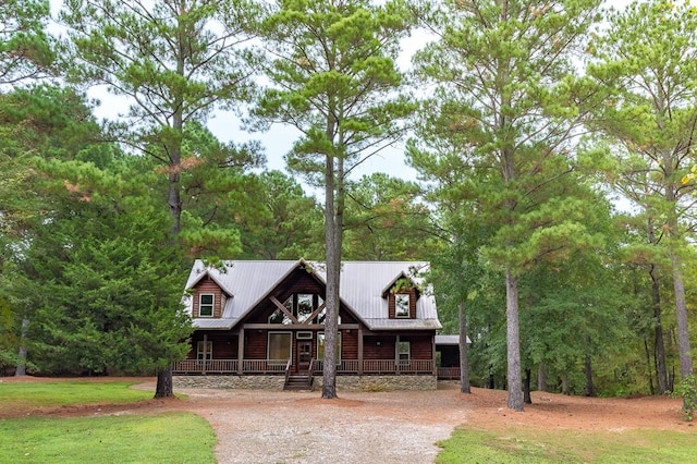 log-style house featuring a porch