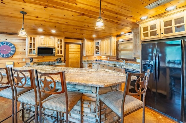 kitchen with black appliances, decorative light fixtures, a kitchen island, and wooden ceiling