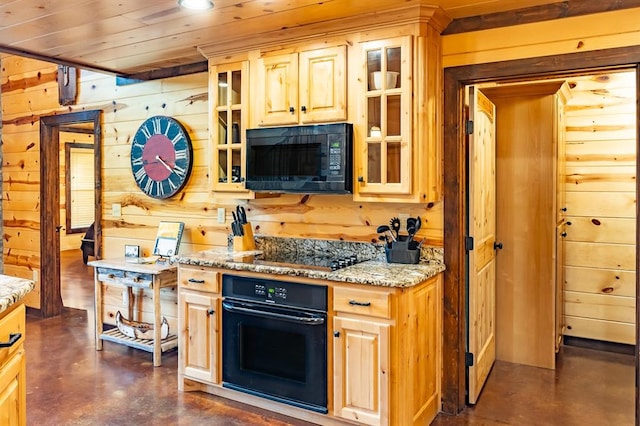 kitchen with wooden ceiling, black appliances, wooden walls, light stone countertops, and light brown cabinetry