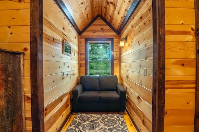 living area featuring dark hardwood / wood-style floors, wood walls, wooden ceiling, and lofted ceiling