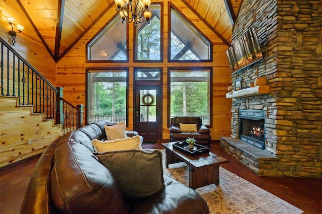 143 Honey Crisp Ln, Broken Bow, OK 74728 - living room featuring vaulted ceiling, healthy amount of natural light, wooden ceiling, stairway, and a stone fireplace