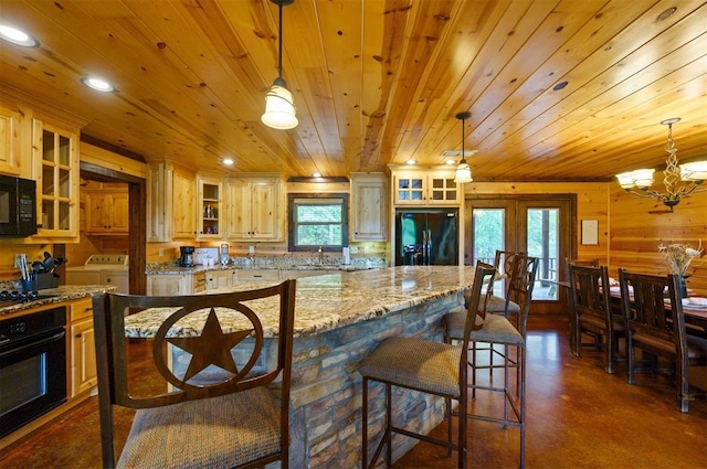 143 Honey Crisp Ln, Broken Bow, OK 74728 - kitchen featuring washing machine and dryer, black appliances, french doors, finished concrete floors, and wood ceiling