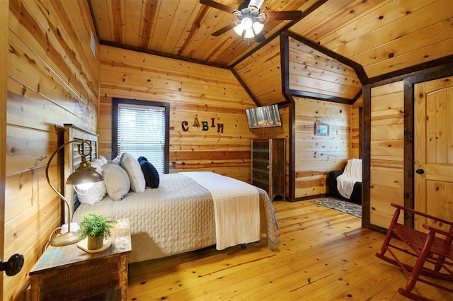 143 Honey Crisp Ln, Broken Bow, OK 74728 - bedroom with wooden ceiling, lofted ceiling, wood walls, and light wood-type flooring