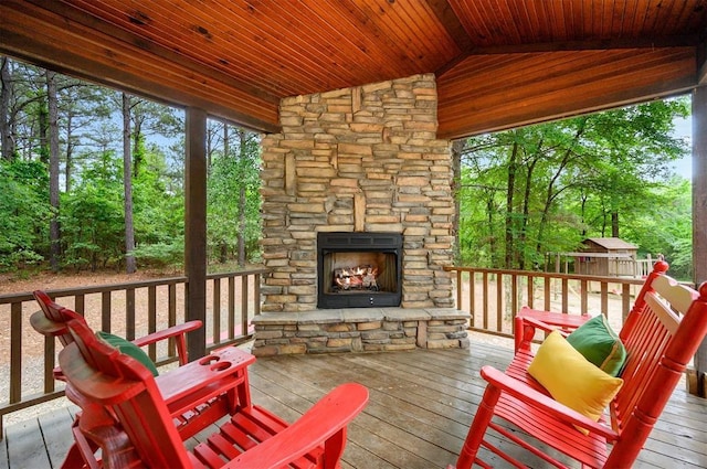 143 Honey Crisp Ln, Broken Bow, OK 74728 - sunroom with lofted ceiling, plenty of natural light, and view of wooded area