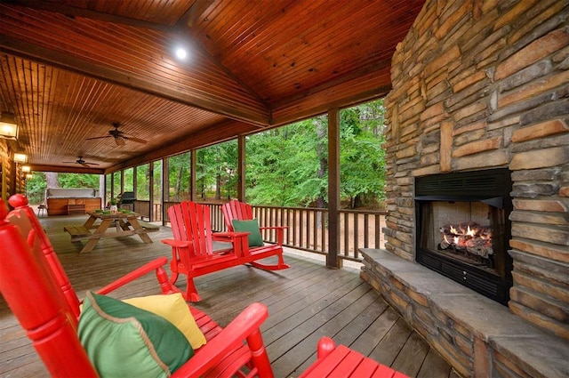 143 Honey Crisp Ln, Broken Bow, OK 74728 - deck featuring an outdoor stone fireplace and ceiling fan