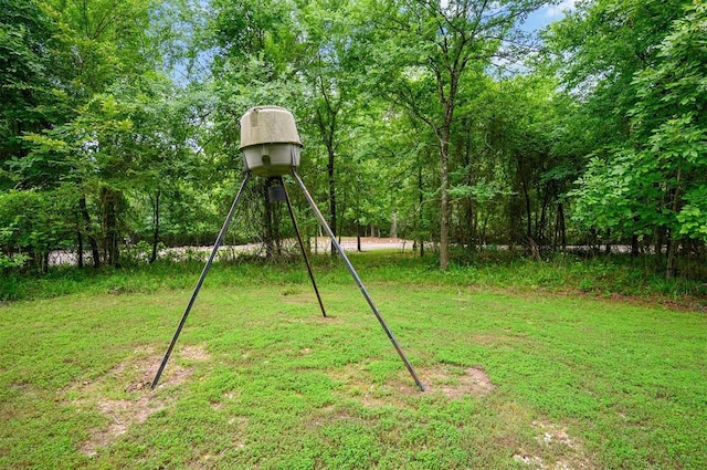 143 Honey Crisp Ln, Broken Bow, OK 74728 - view of green lawn featuring a forest view