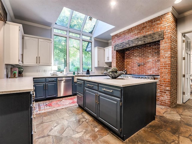 kitchen with a skylight, stainless steel dishwasher, crown molding, a center island, and white cabinetry