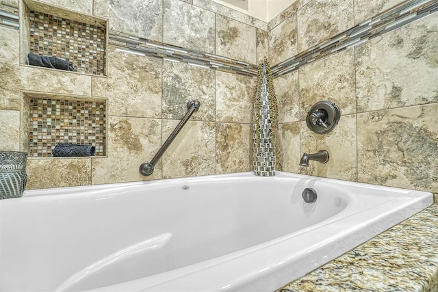 bathroom with tiled tub