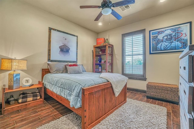 bedroom featuring dark hardwood / wood-style floors and ceiling fan