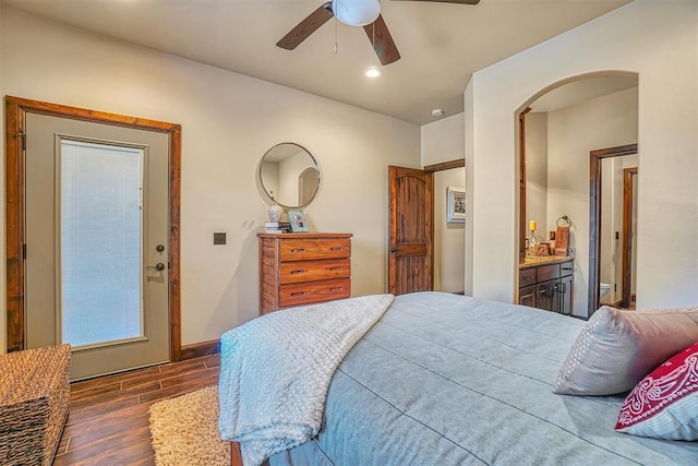 bedroom featuring ensuite bath, ceiling fan, and dark hardwood / wood-style flooring