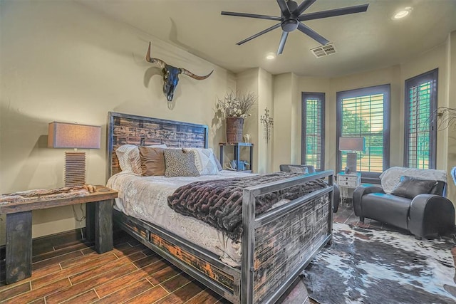 bedroom featuring dark hardwood / wood-style floors and ceiling fan