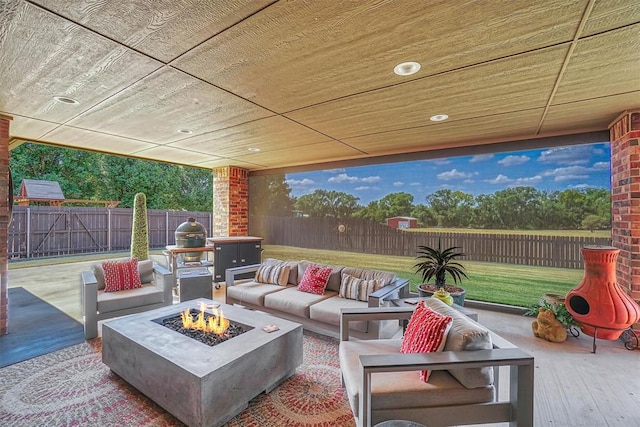 view of patio / terrace featuring grilling area and an outdoor living space with a fire pit