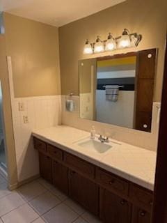 1305 SE 15th St, Wagoner, OK 74467 - bathroom featuring vanity, tile patterned floors, and wainscoting