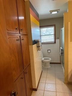 1305 SE 15th St, Wagoner, OK 74467 - full bathroom featuring tile patterned floors, an enclosed shower, and toilet