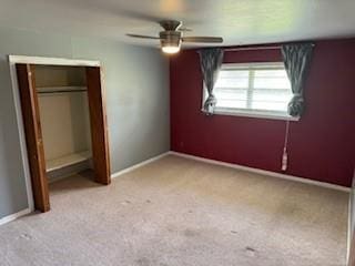 1305 SE 15th St, Wagoner, OK 74467 - unfurnished bedroom with carpet floors, baseboards, and ceiling fan