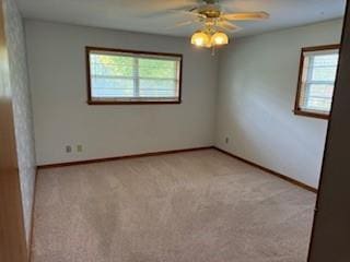1305 SE 15th St, Wagoner, OK 74467 - empty room with a ceiling fan, light colored carpet, and baseboards