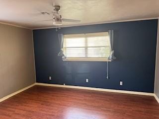 1305 SE 15th St, Wagoner, OK 74467 - spare room with wood finished floors, baseboards, and a ceiling fan