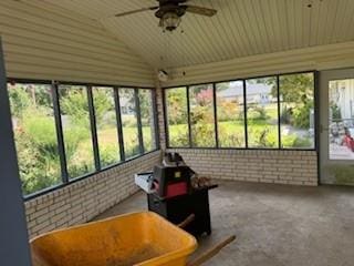 1305 SE 15th St, Wagoner, OK 74467 - sunroom / solarium featuring brick wall, healthy amount of natural light, ceiling fan, lofted ceiling, and wooden ceiling