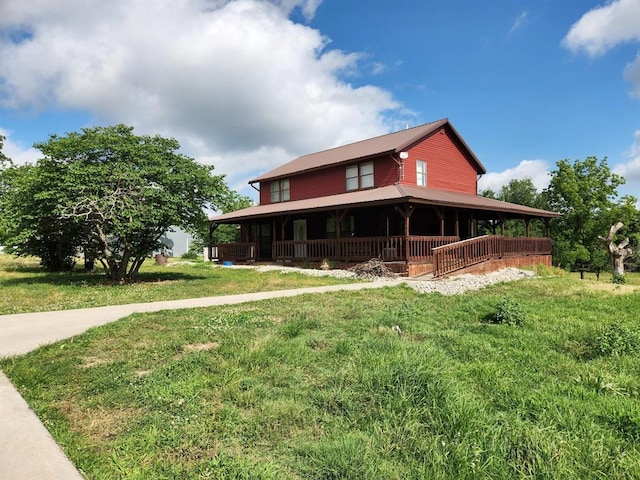 farmhouse with a front lawn and a porch