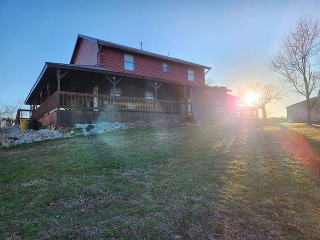 view of back house at dusk