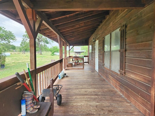 wooden terrace featuring covered porch