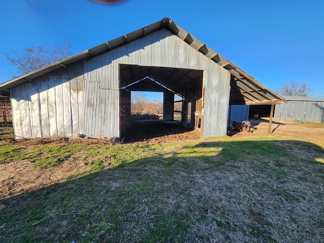 view of outdoor structure with a lawn