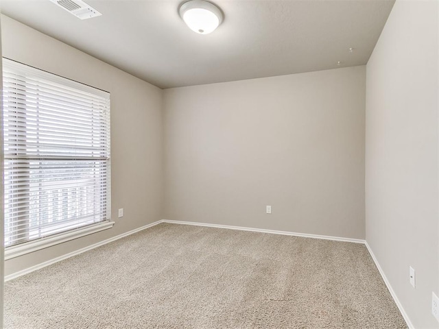 unfurnished room featuring carpet