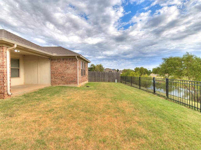 view of yard with a water view