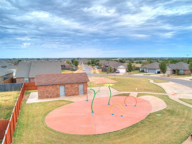 view of property's community featuring a yard