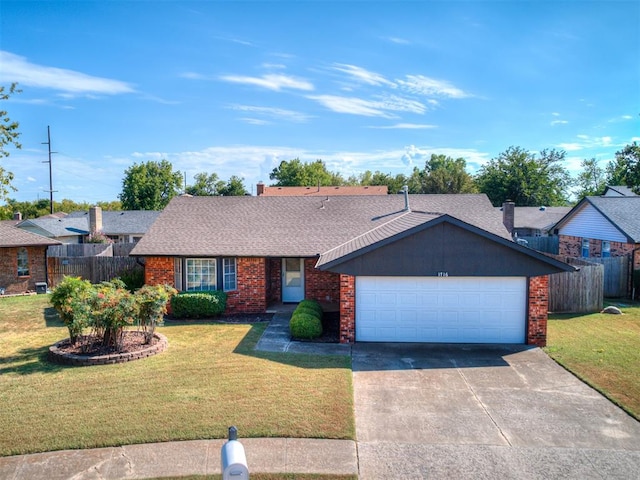 ranch-style house with a garage and a front lawn