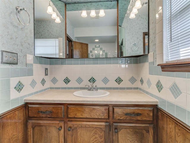 bathroom featuring decorative backsplash and vanity