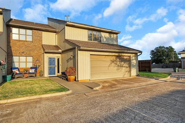 view of front of house featuring a garage and a front yard