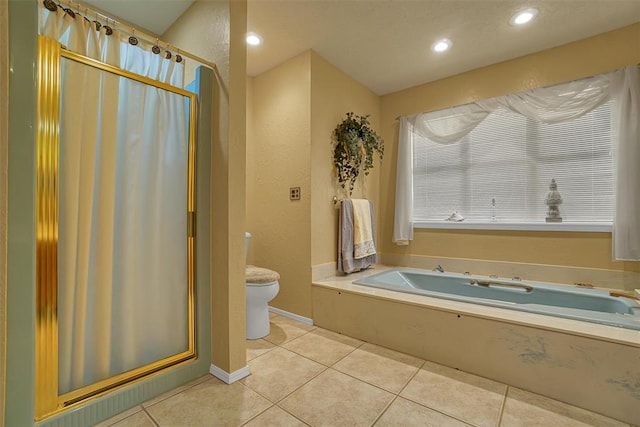 bathroom with tile patterned flooring, toilet, and plus walk in shower