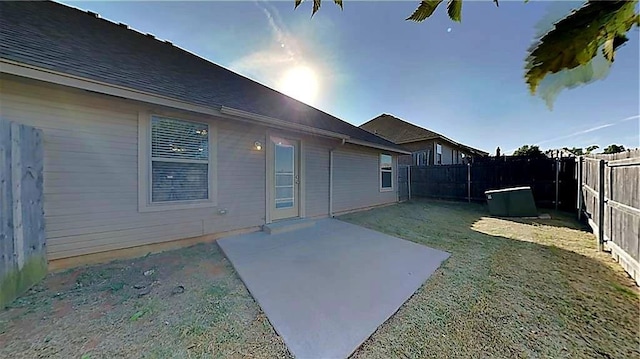 11221 Coachmans Rd, Yukon, OK 73099 - fenced backyard with a patio area