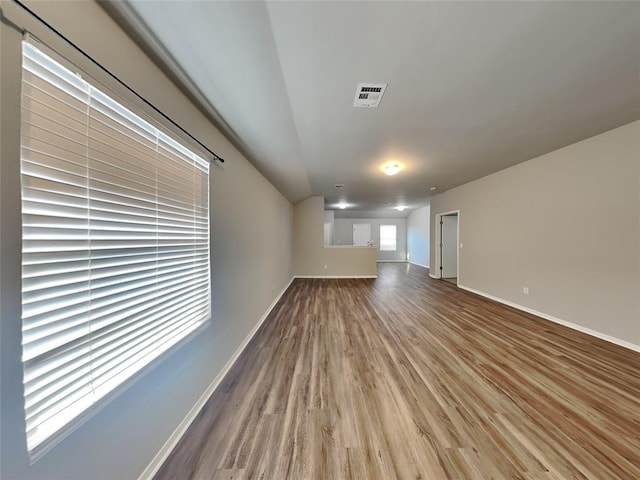 unfurnished living room with hardwood / wood-style floors