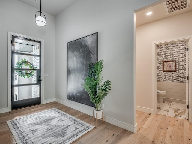 entrance foyer with light hardwood / wood-style flooring