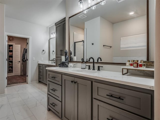 bathroom featuring vanity and an enclosed shower