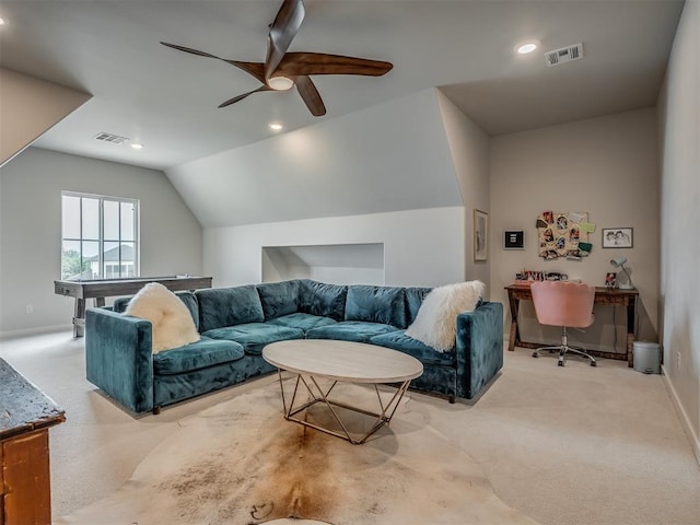 carpeted living room featuring ceiling fan and lofted ceiling