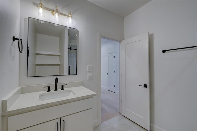 bathroom with tile patterned flooring and vanity