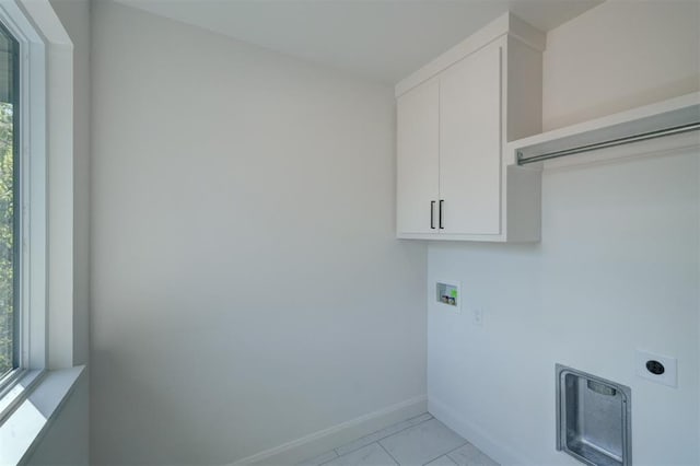 washroom featuring washer hookup, cabinet space, hookup for an electric dryer, and baseboards