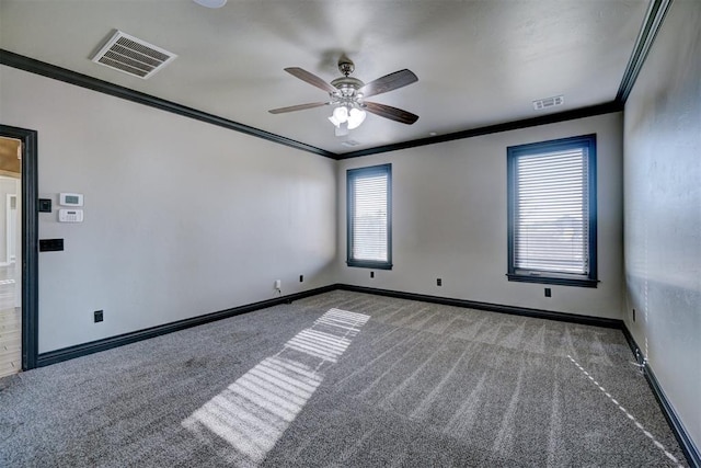 carpeted spare room featuring ceiling fan and ornamental molding