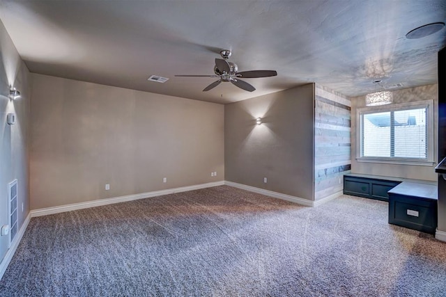 interior space featuring carpet flooring and ceiling fan