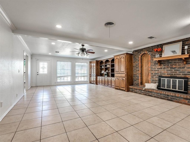 unfurnished living room featuring a fireplace, ceiling fan, crown molding, and light tile patterned floors